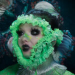 Bjork in green flower head mask